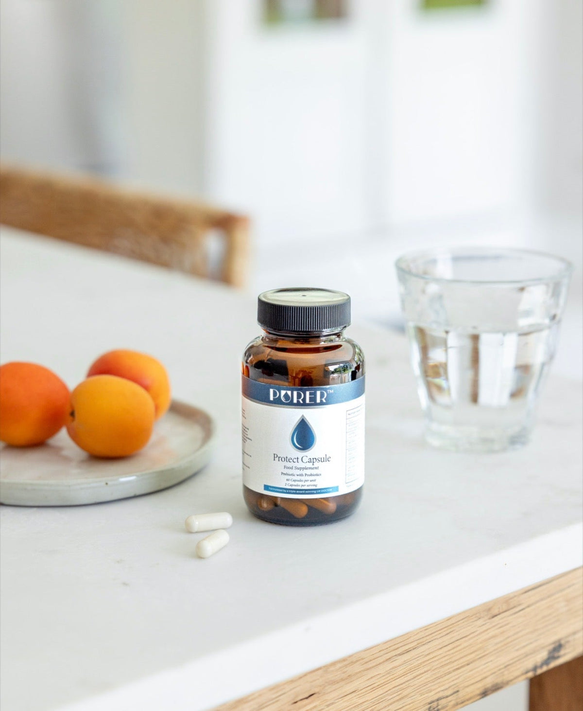 BePurer The Protect – Live Cultures & Inulin Capsules – bottle beside water and fruit