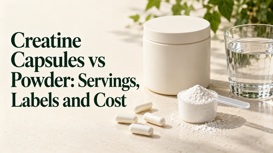 Four capsules, a powder scoop and a glass of water on a neutral tabletop beneath the article title