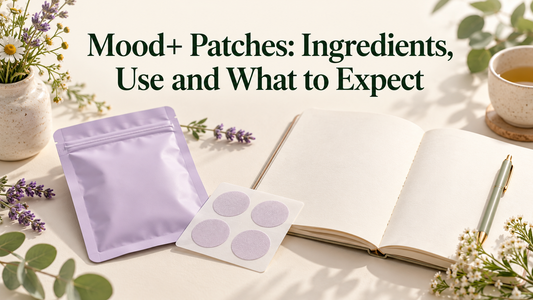 A plain lilac pouch and patch sheet beside a notebook and botanical sprigs