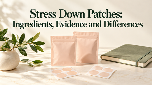 Plain peach pouches and round patch sheets beside a notebook and leafy branch