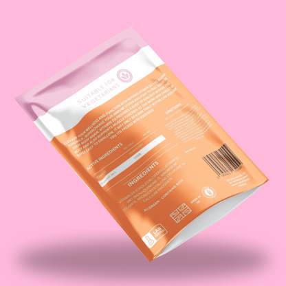 Orange package with white label on a pink background