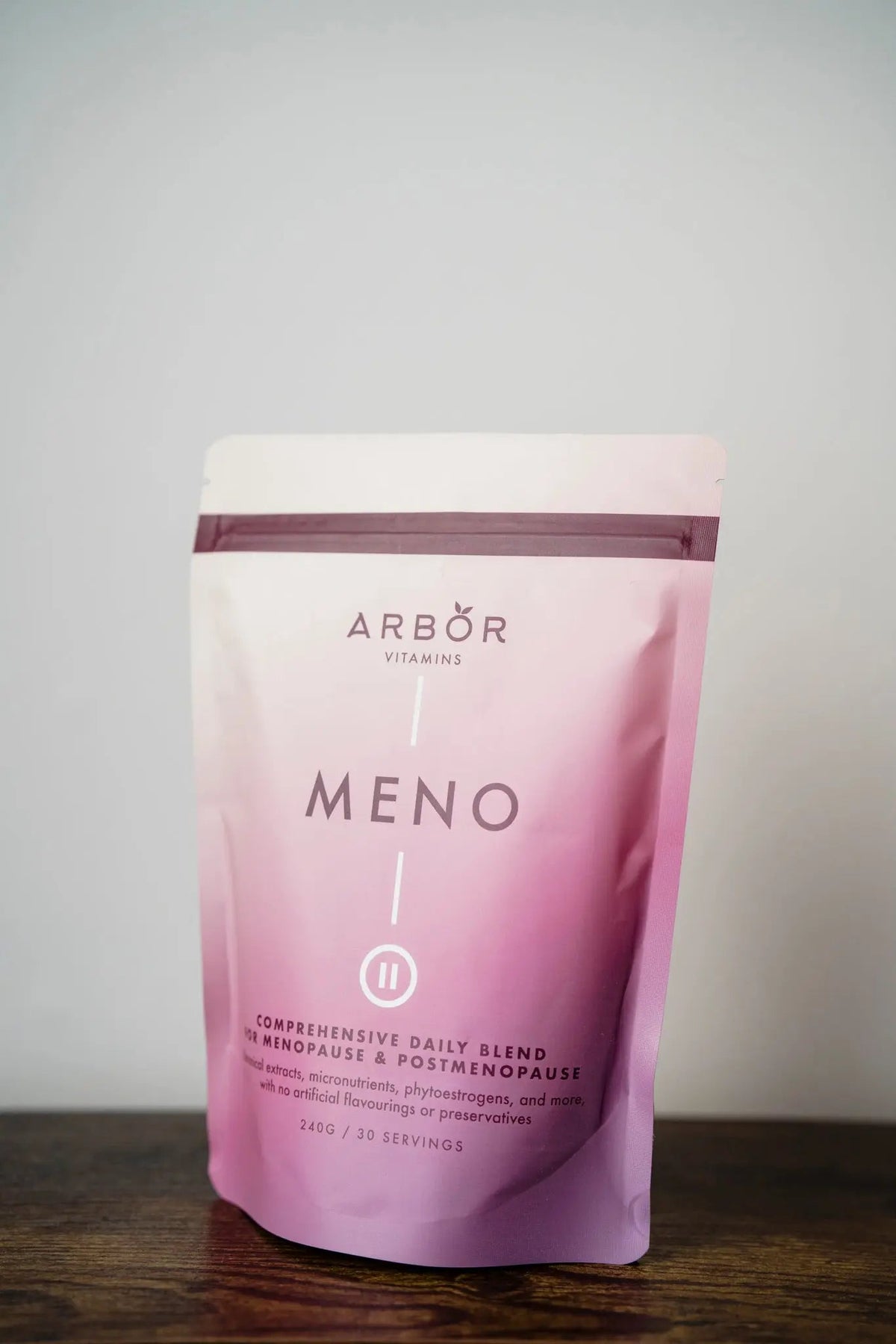 Pink Arbor Vitamins MENO Blend pouch displayed on a wooden surface