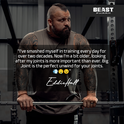 Tattooed strength athlete with barbell and Beast Pharm brand quote