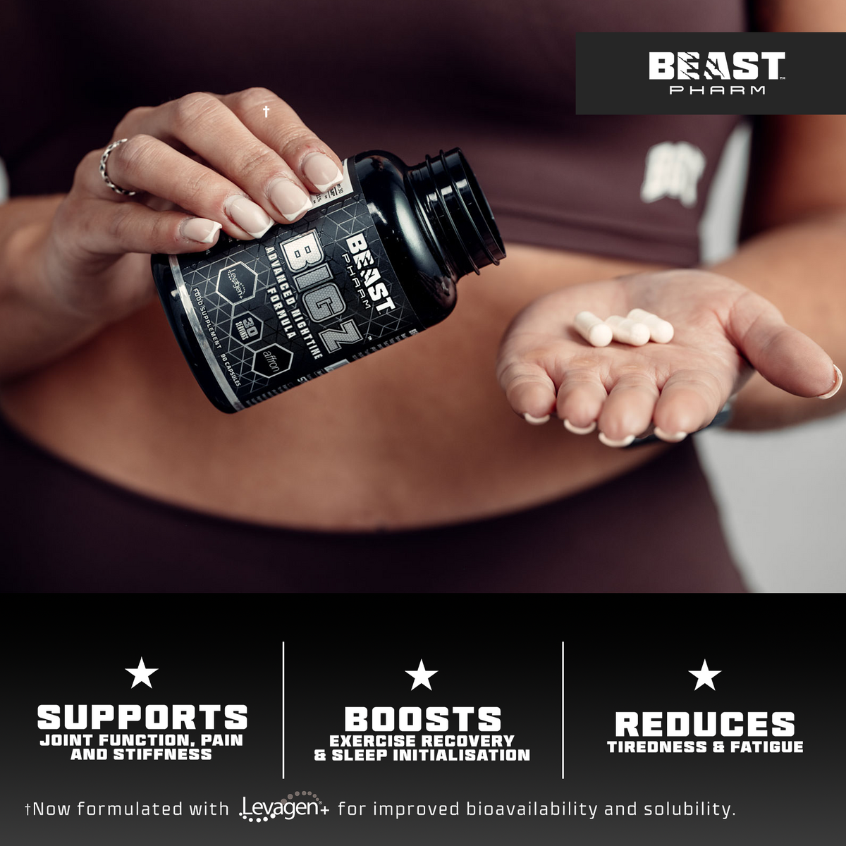 Person holding a bottle of Beast Pharm supplements with pills in their hand, featuring the brand's logo.