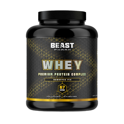 A black plastic tub of Beast Pharm Whey Premium Protein Complex in Hamptons Pie flavor, featuring a black and gold label with white text.