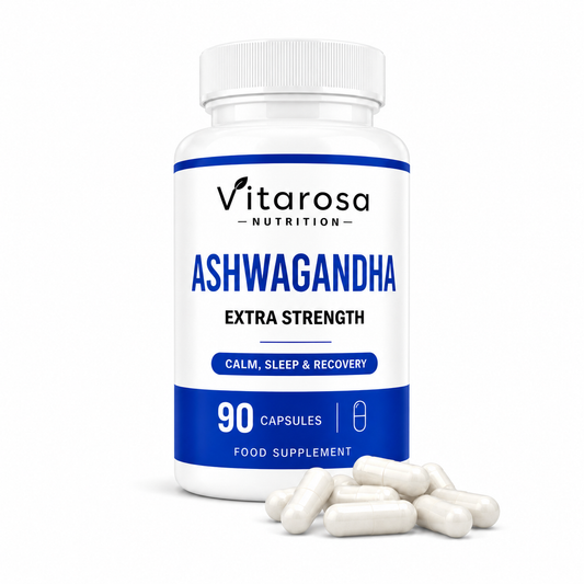 A white bottle of Vitarosa Nutrition Ashwagandha Extra Strength food supplement with a white cap, shown on a white background with several white capsules scattered in front.