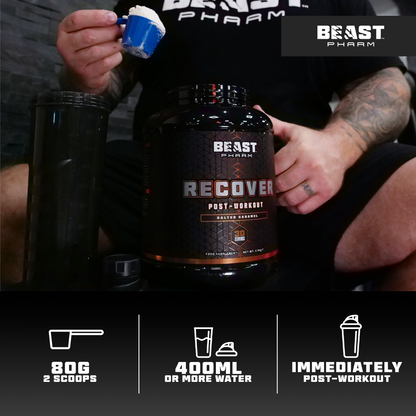 Person holding a container of Beast Pharm Recover supplement with product details displayed.