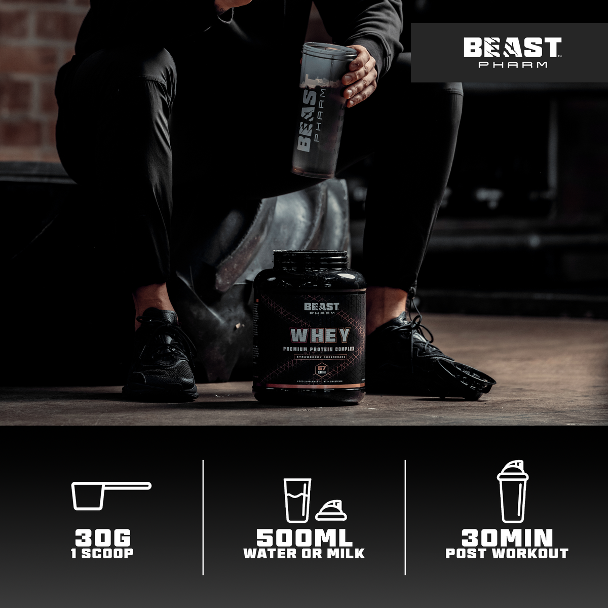 Person holding a Beast Protein shaker with Beast Protein products on the floor, featuring the Beast Pharm brand.