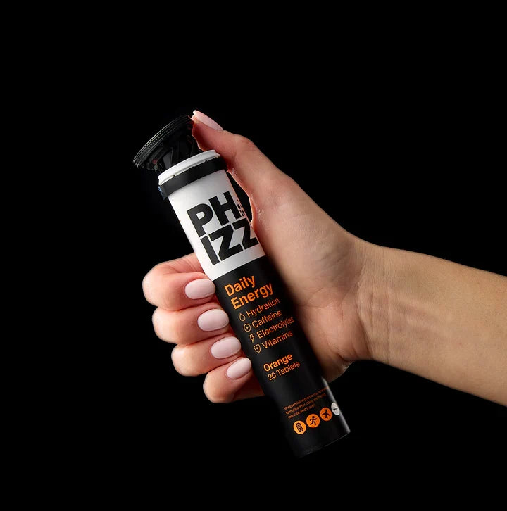 Phizz Daily Energy Caffeine Orange – Multipack – hand holding the tablet tube