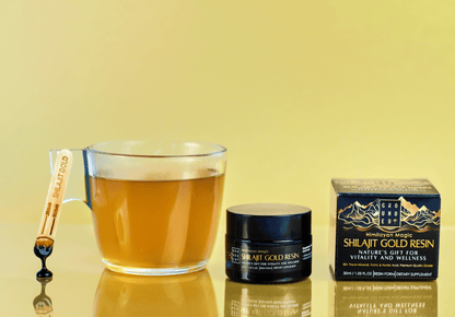 Grounded Himalayan Magic Shilajit Gold Resin – 30ml – resin jar and spatula beside a drink