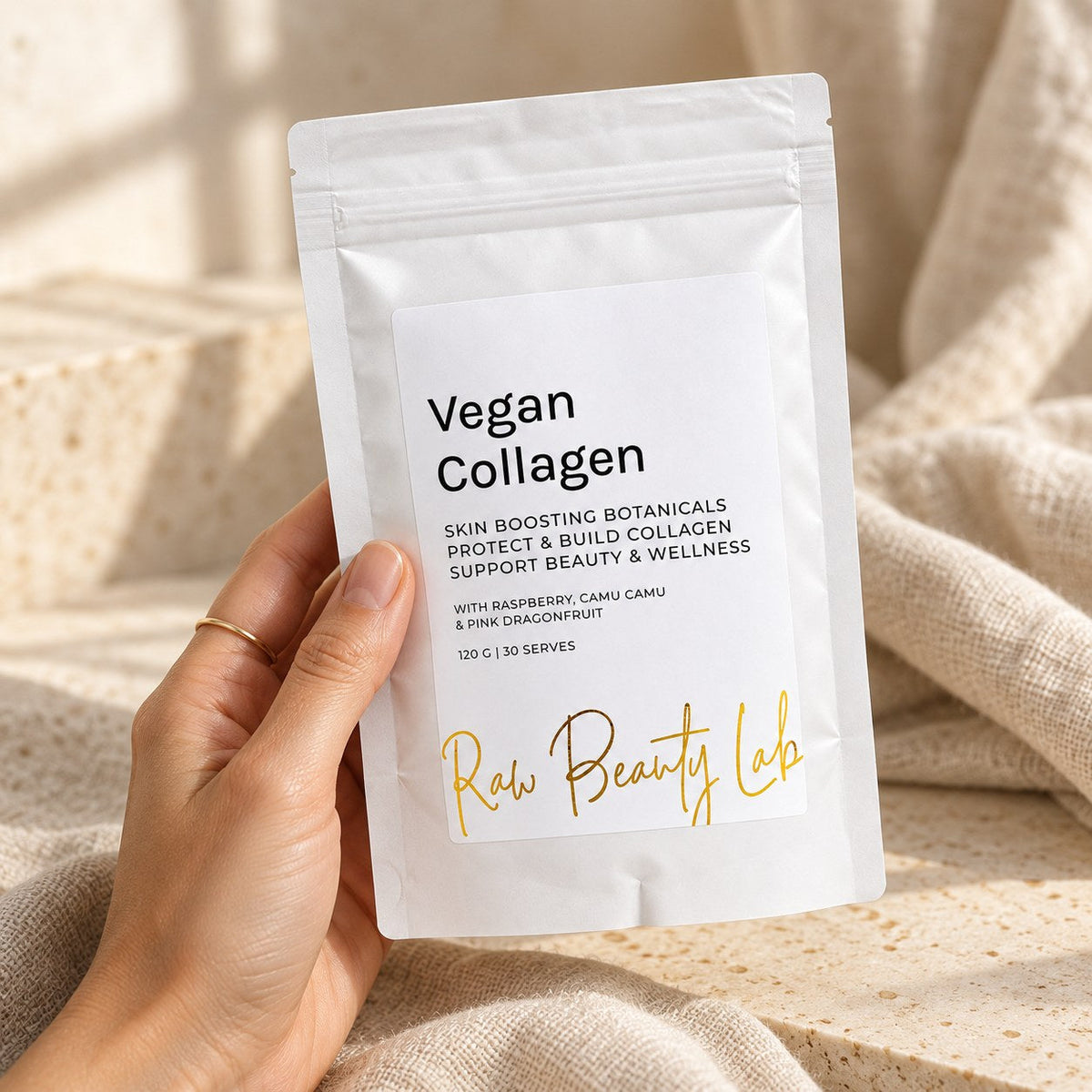 Raw Beauty Lab Vegan Collagen Booster – pouch held in hand