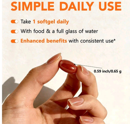 A hand holds a single reddish-brown softgel capsule with text reading 'SIMPLE DAILY USE' and usage instructions above it. A small measurement note indicates the capsule is 0.