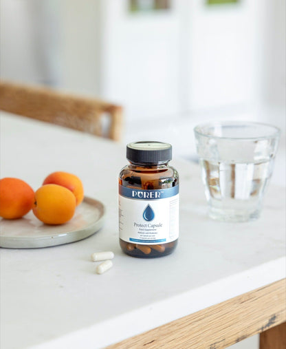 BePurer The Protect – Live Cultures & Inulin Capsules – bottle beside water and fruit